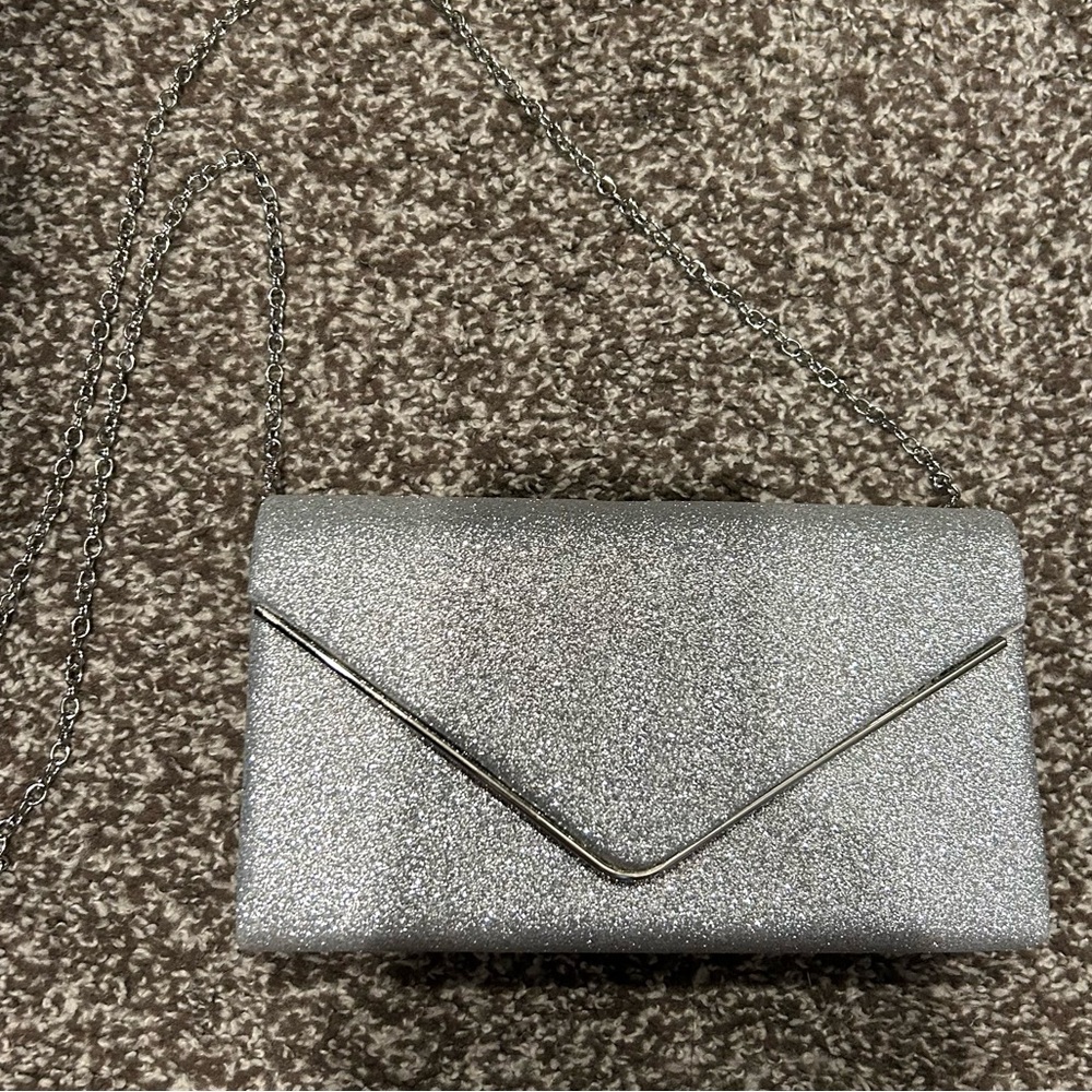 Sparkly silver purse in new condition. With silver chain strap